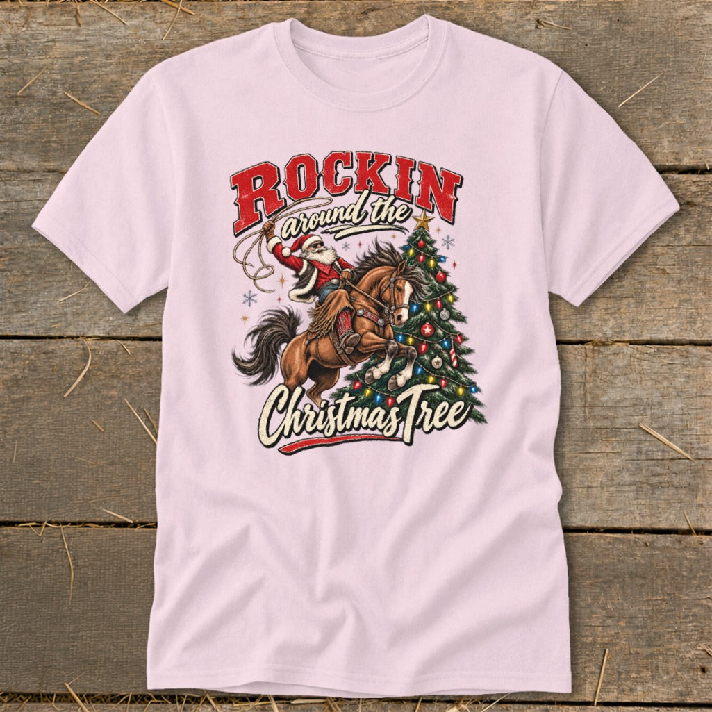 Santa riding a horse with lasso near a decorated Christmas tree, text "Rockin around the Christmas Tree".