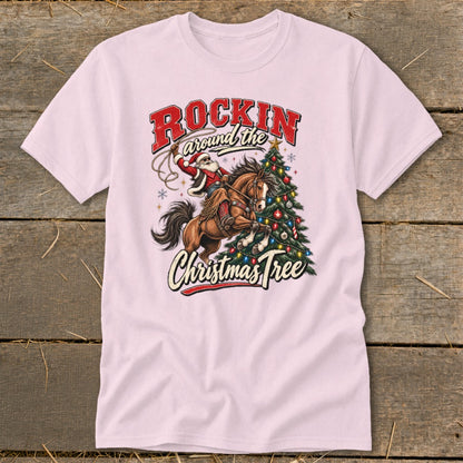 Santa riding a horse with lasso near a decorated Christmas tree, text "Rockin around the Christmas Tree".