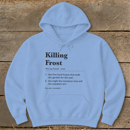 Light blue hooded sweatshirt featuring black dictionary-style text defining Killing Frost on a rustic wooden background.