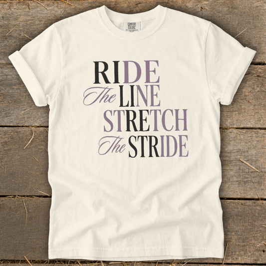 Cream t-shirt with "RIDE The LINE STRETCH The STRIDE" text in purple and black.