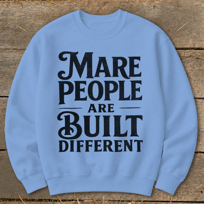 Light blue sweatshirt with black text: "MARE PEOPLE ARE BUILT DIFFERENT".