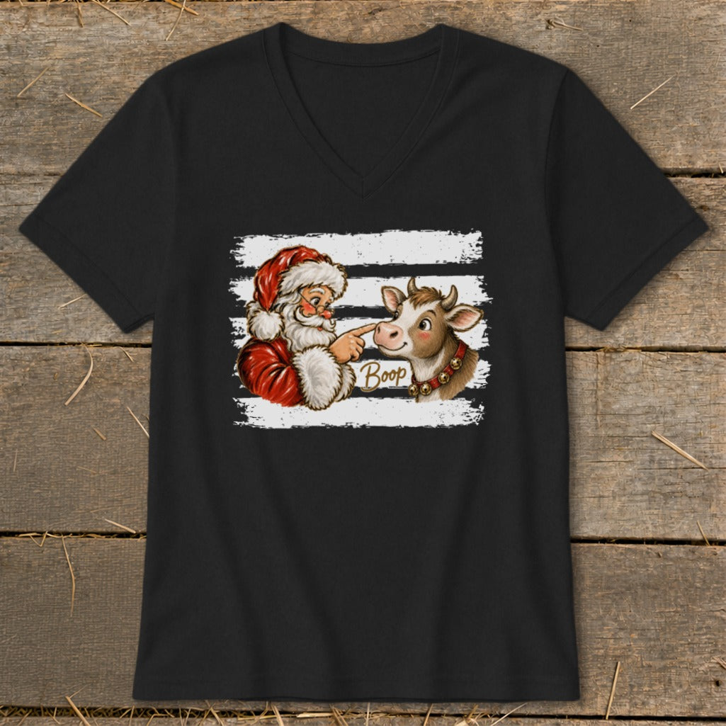Santa "booping" a cow on the nose with the word "Boop" written on the image.