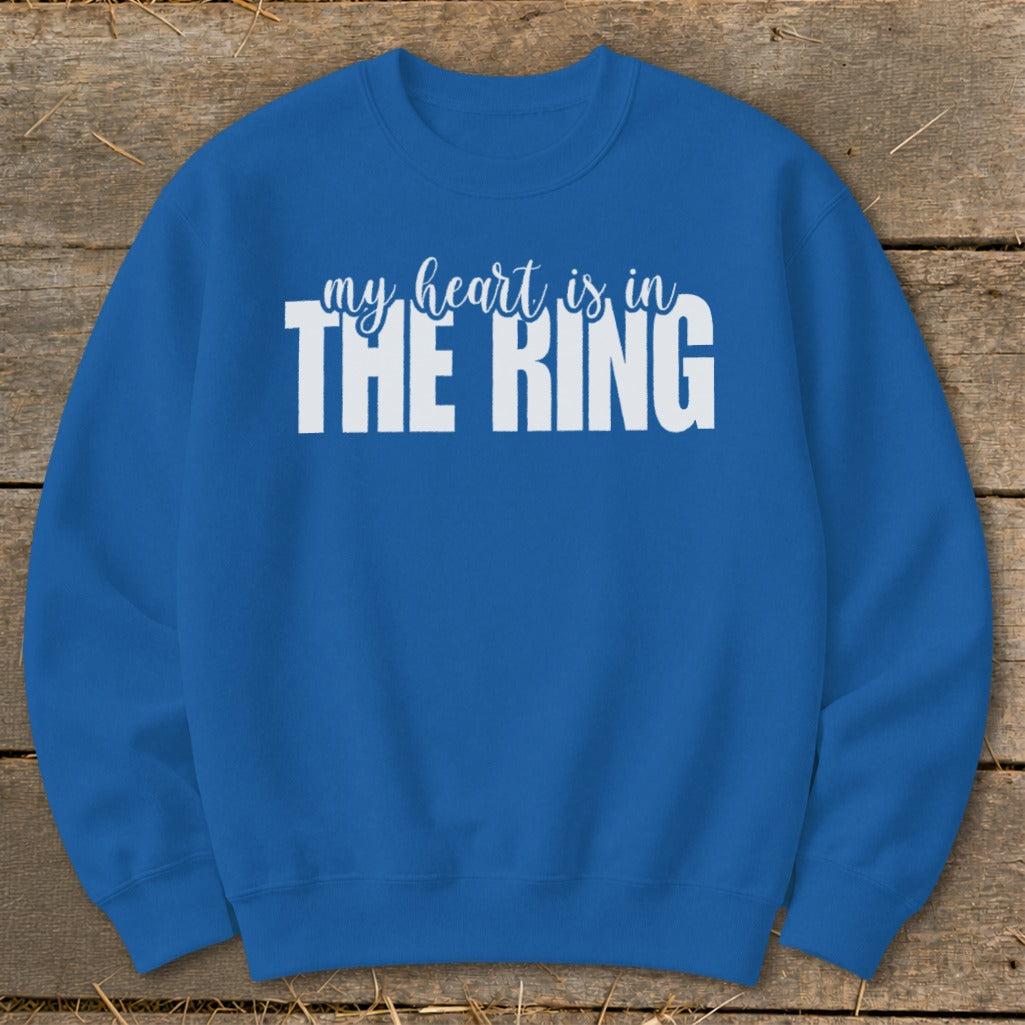 Blue sweatshirt with white text "my heart is in THE RING".