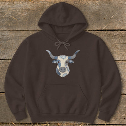 Brown hoodie with a blue and white patchwork bull head graphic on the chest.
