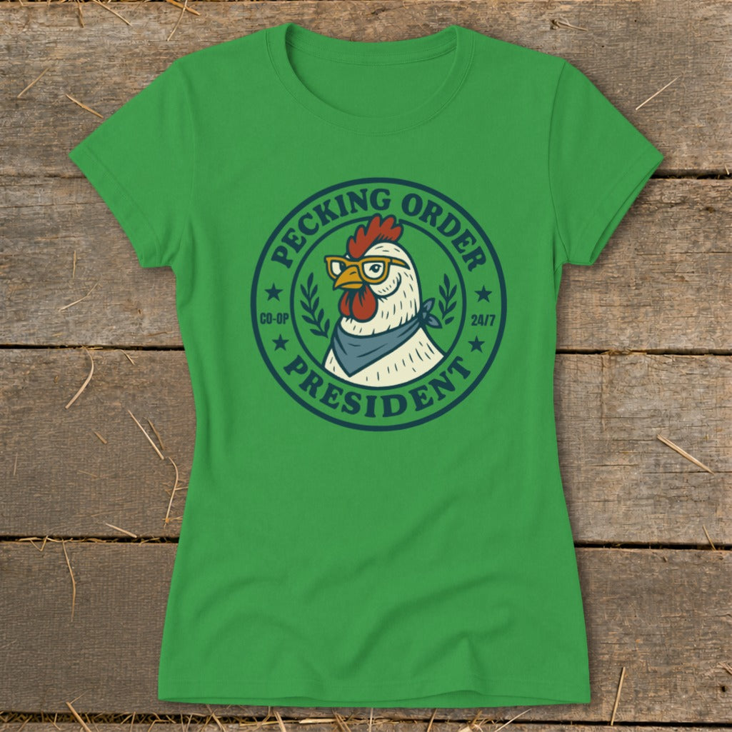 Green t-shirt with a circular graphic of a chicken wearing glasses and a bandana, labeled "Pecking Order President".