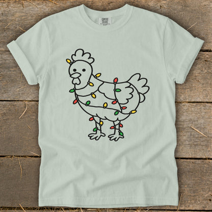 Light green t-shirt with a line drawing of a chicken wrapped in colorful Christmas lights.