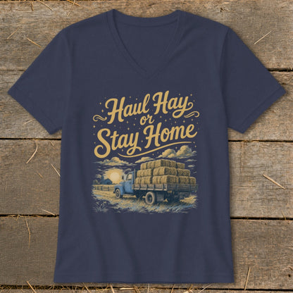 Navy v-neck t-shirt with "Haul Hay or Stay Home" text and illustration of a truck with hay bales.