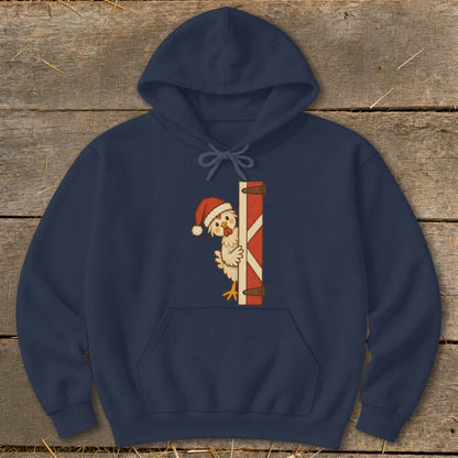 Navy hoodie with a cartoon chicken in a Santa hat peeking behind a barn door.