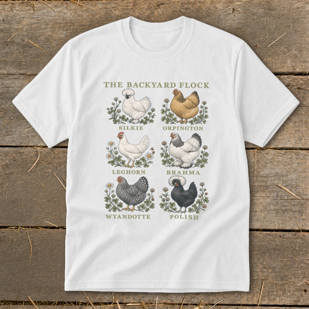 White t-shirt featuring "The Backyard Flock" title and six chicken illustrations with breed names.