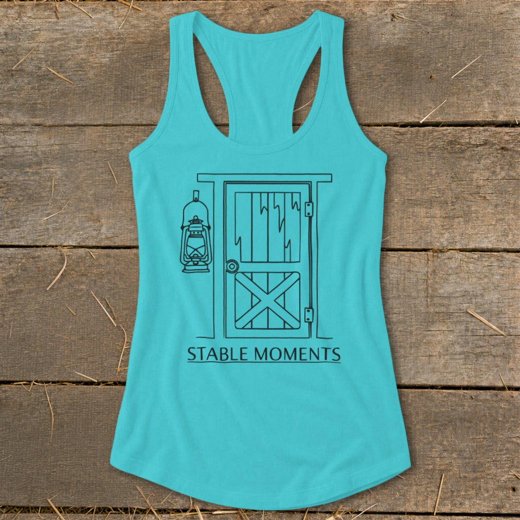Turquoise tank top with a barn door and lantern graphic and text "STABLE MOMENTS".