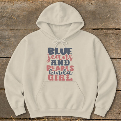 Cream hoodie with "BLUE jeans AND PEARLS kinda GIRL" text graphic.