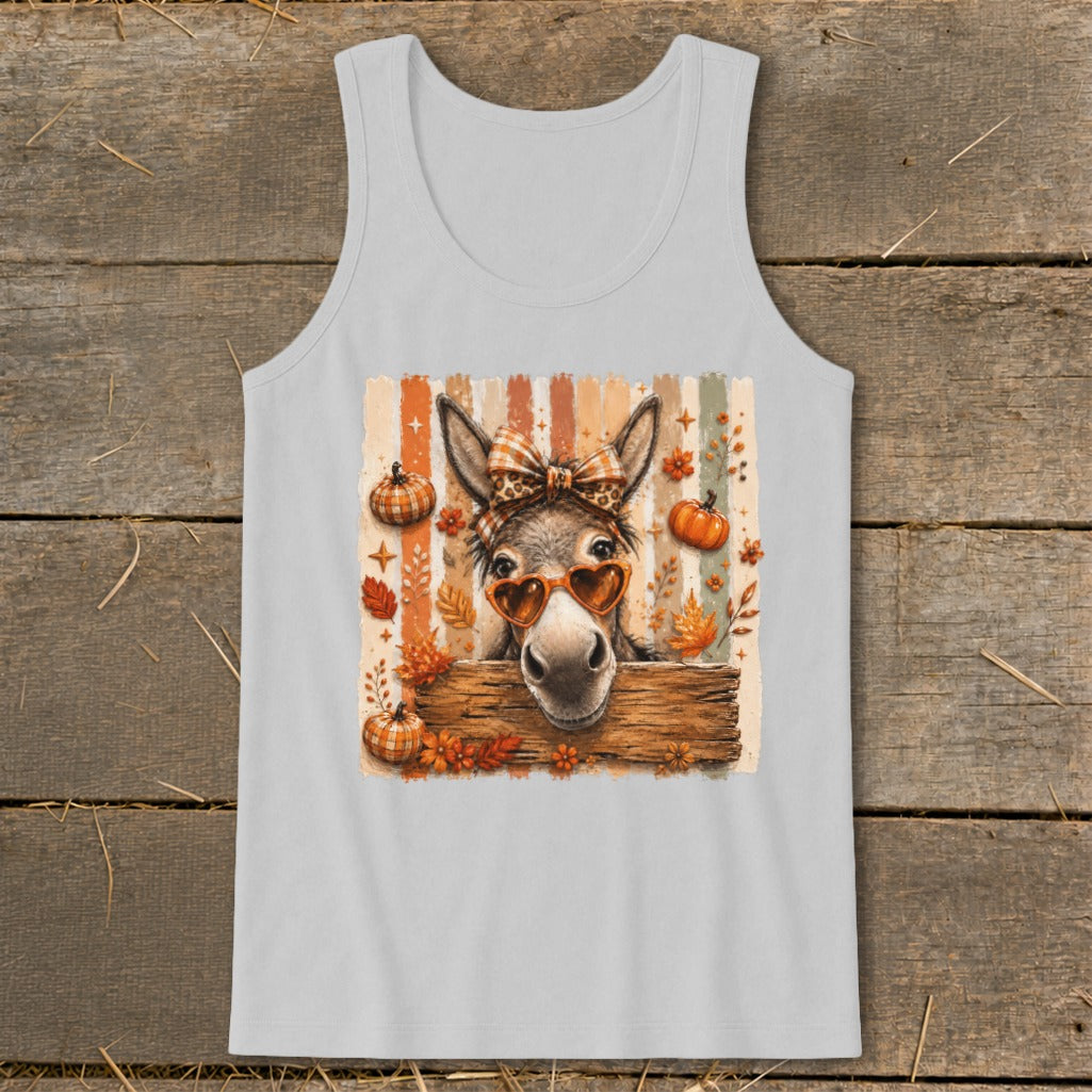 Donkey wearing heart sunglasses and bow, with pumpkins and fall leaves.