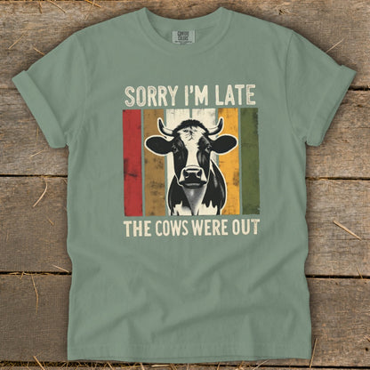 Green t-shirt with distressed cow graphic and text "Sorry I'm Late The Cows Were Out".