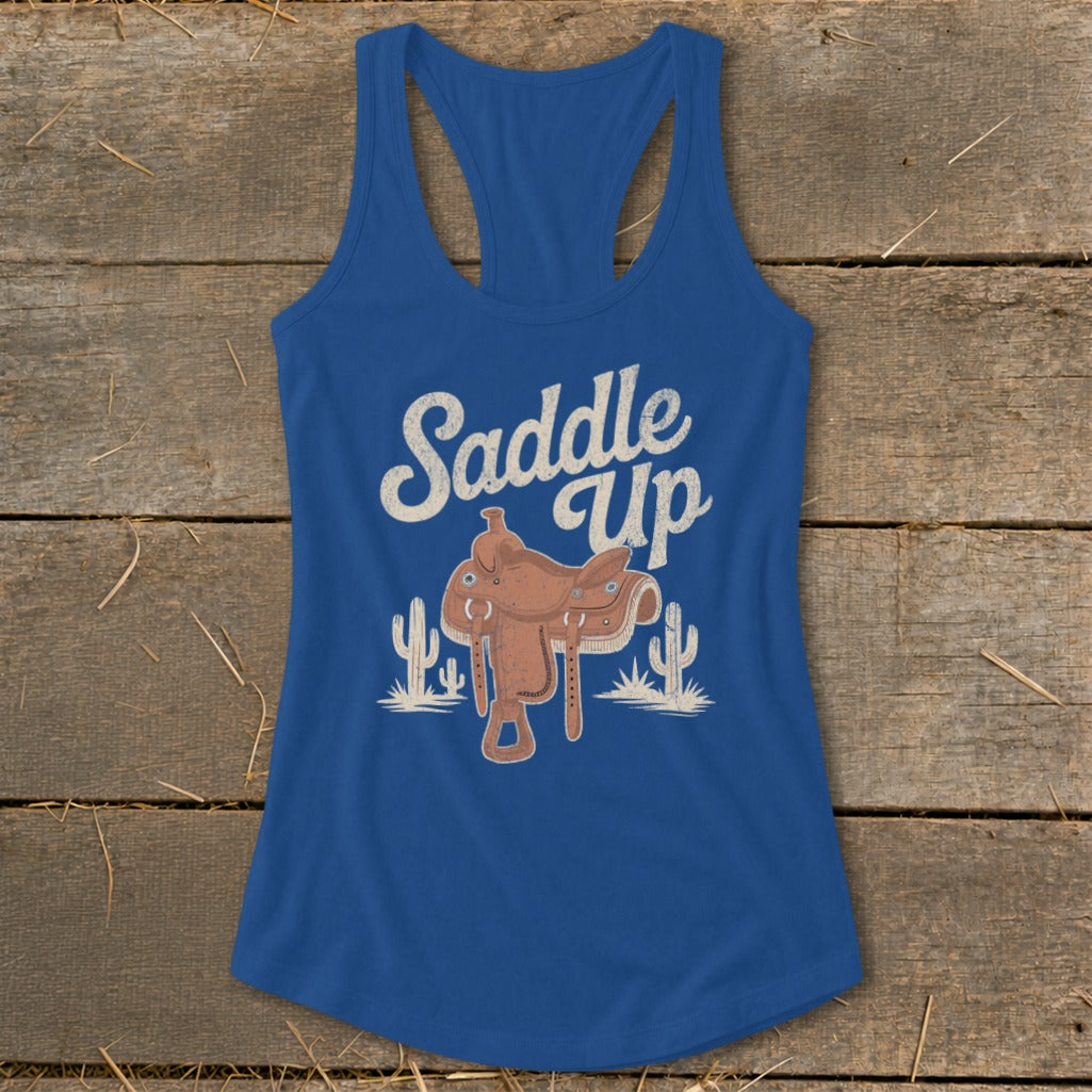 Blue tank top with "Saddle Up" text, saddle, and cacti graphic.