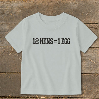 A light gray short-sleeved child's t-shirt printed with the text 12 HENS = 1 EGG.