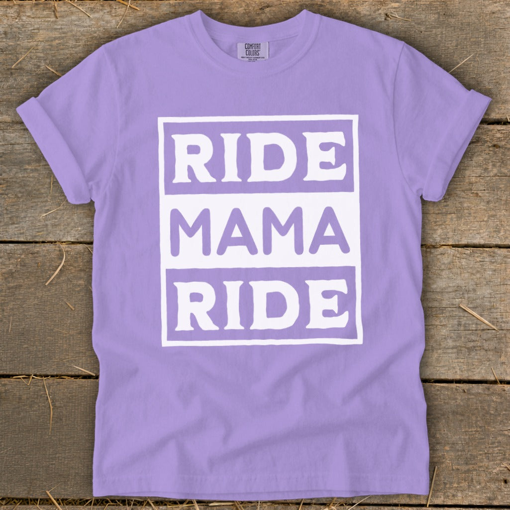 Purple t-shirt with white text reading "RIDE MAMA RIDE" stacked in boxes.