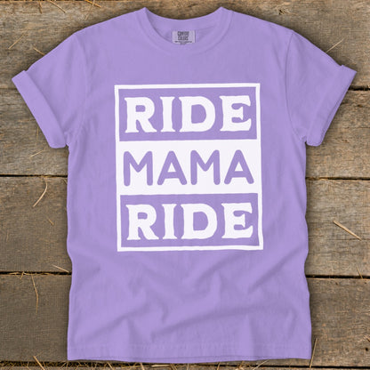 Purple t-shirt with white text reading "RIDE MAMA RIDE" stacked in boxes.