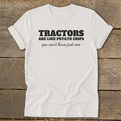 White t-shirt with black text: Tractors are like potato chips you can't have just one.