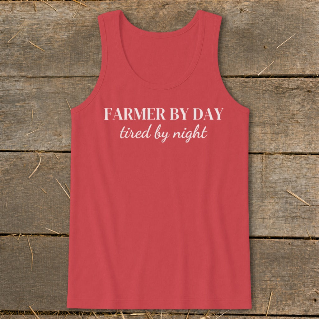 Red tank top with white text "FARMER BY DAY tired by night."