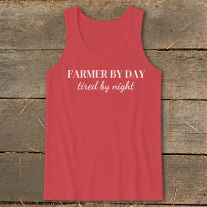 Red tank top with white text "FARMER BY DAY tired by night."