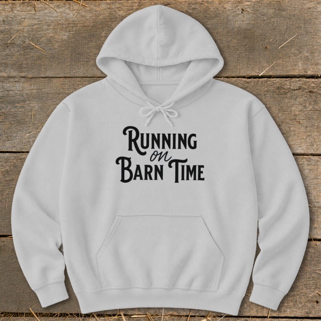 White hoodie with black text reading "Running on Barn Time."