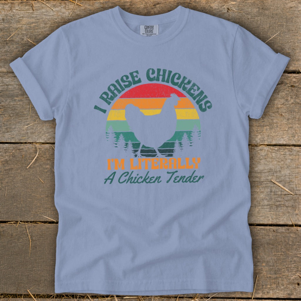 Light blue t-shirt with distressed graphic of chicken and text "I RAISE CHICKENS I'M LITERALLY A Chicken Tender."