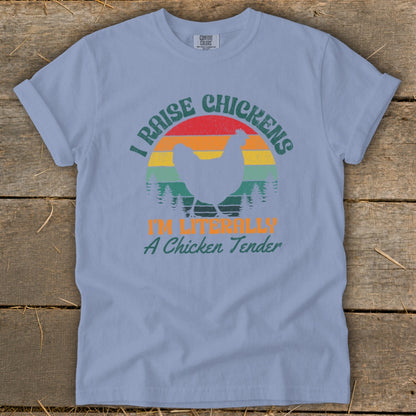 Light blue t-shirt with distressed graphic of chicken and text "I RAISE CHICKENS I'M LITERALLY A Chicken Tender."