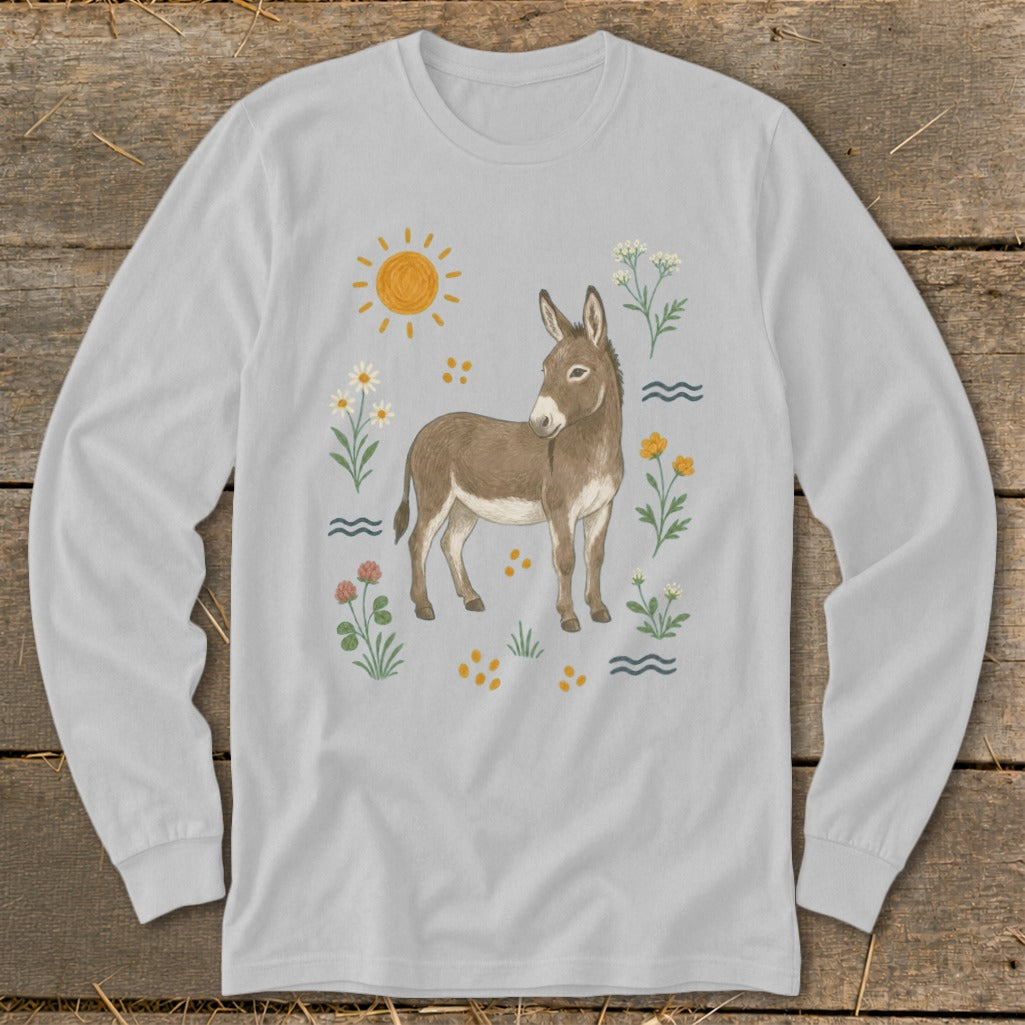 Donkey illustration with sun, flowers, and water elements on a light grey long-sleeved shirt.