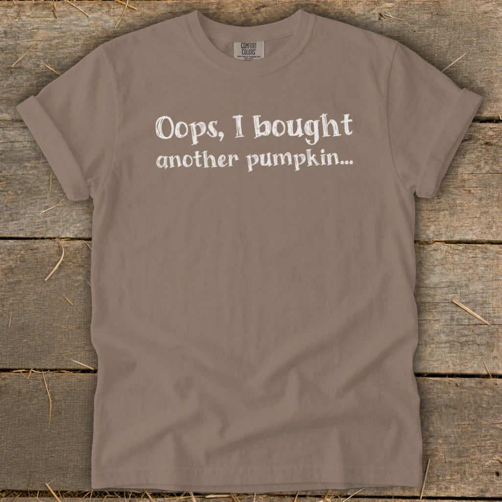 Taupe t-shirt with white text that reads "Oops, I bought another pumpkin..."