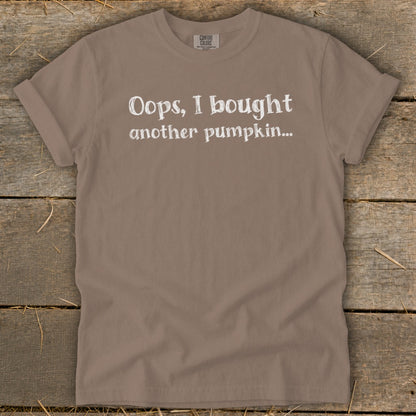 Taupe t-shirt with white text that reads "Oops, I bought another pumpkin..."