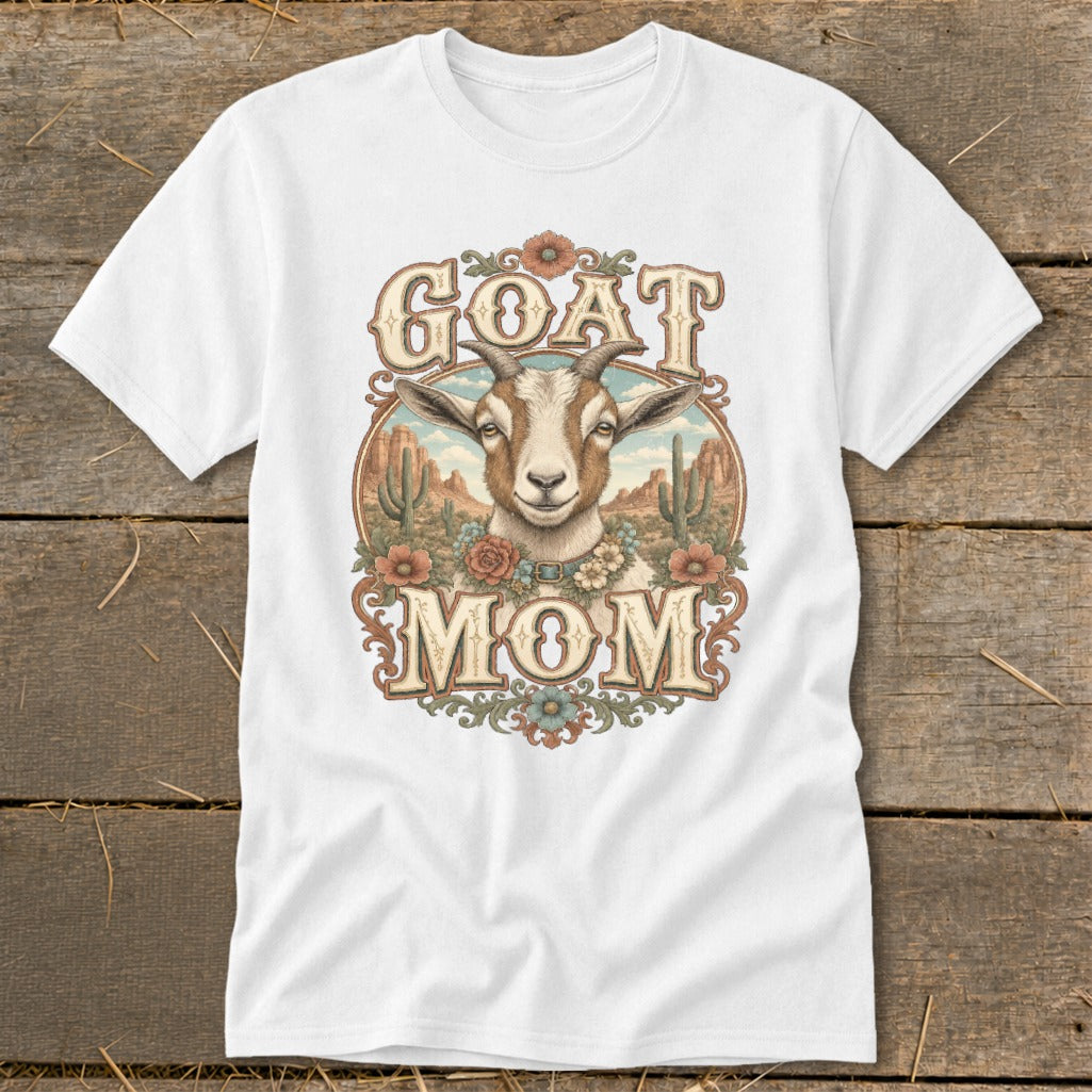 White t-shirt with "GOAT MOM" text and a goat in a desert landscape.
