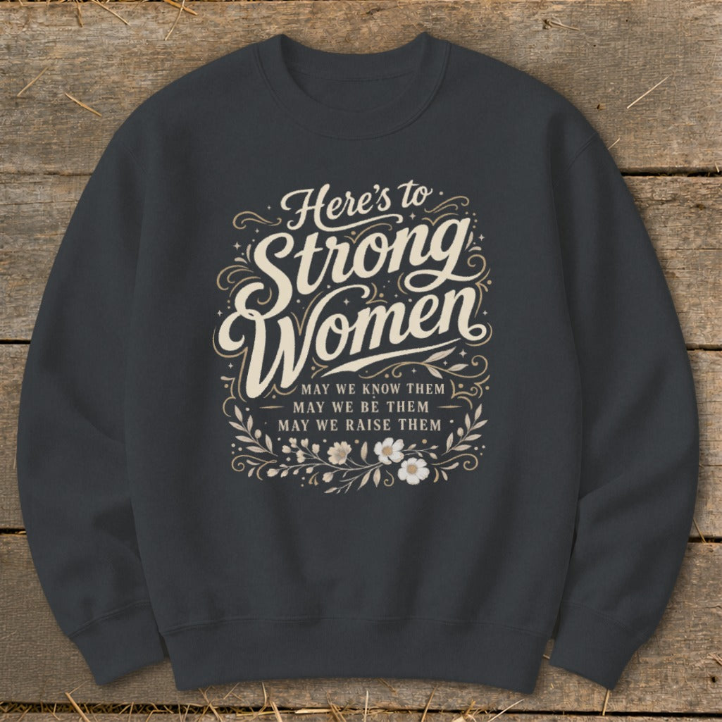 Dark gray sweatshirt with "Here's to Strong Women" and inspirational text.