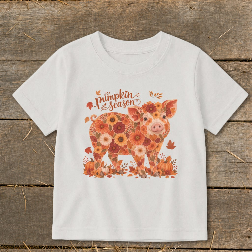 White t-shirt with a pig graphic made of autumn flowers and the words "pumpkin season".