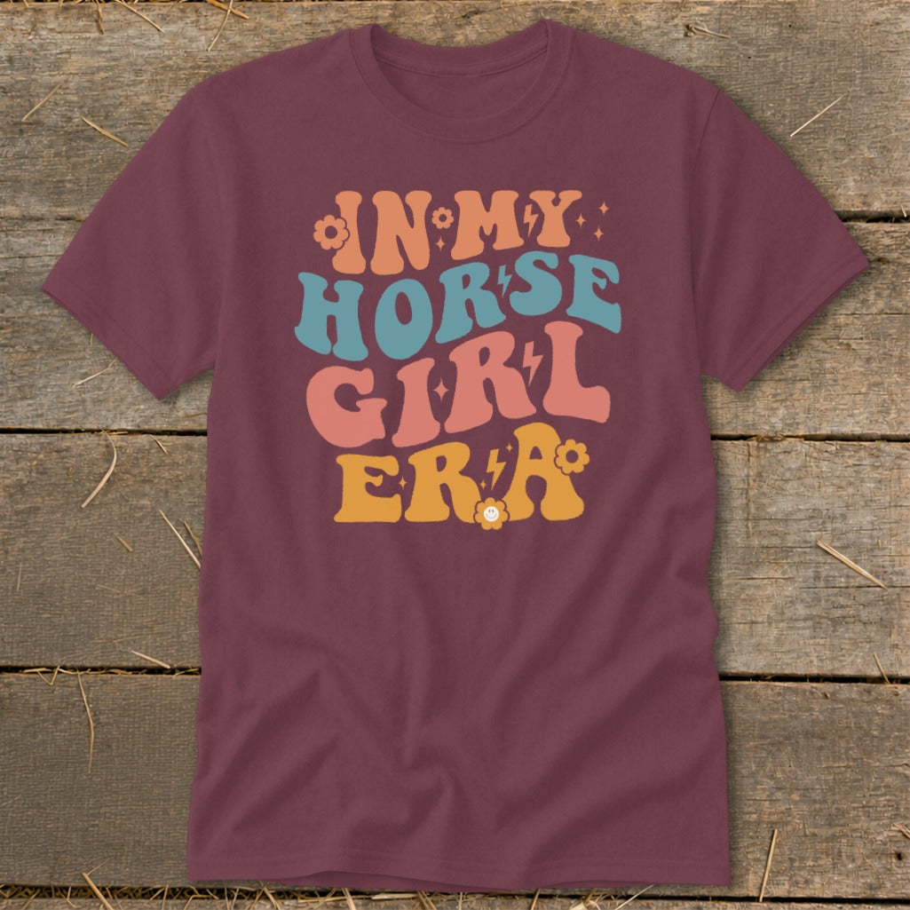 Maroon t-shirt with "In My Horse Girl Era" text in retro lettering and flowers.