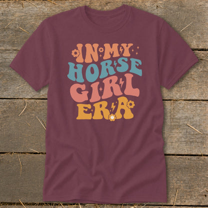 Maroon t-shirt with "In My Horse Girl Era" text in retro lettering and flowers.