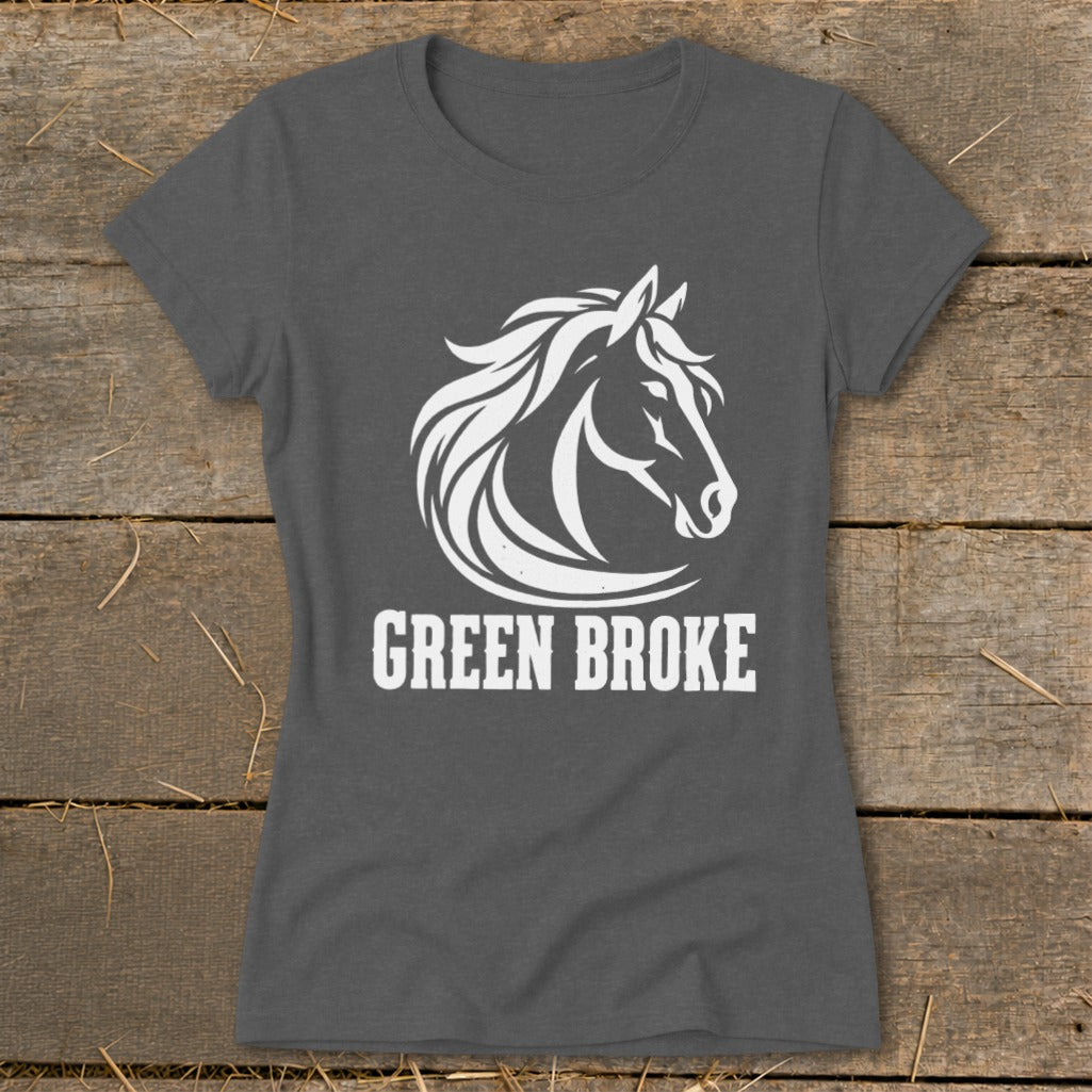 Charcoal grey t-shirt featuring a white horse head graphic and the text GREEN BROKE on a rustic wooden background.