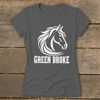 Charcoal grey t-shirt featuring a white horse head graphic and the text GREEN BROKE on a rustic wooden background.