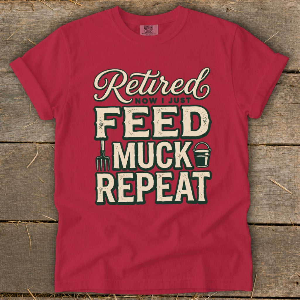 Red t-shirt with "Retired Now I Just Feed Muck Repeat" graphic and farm tools.