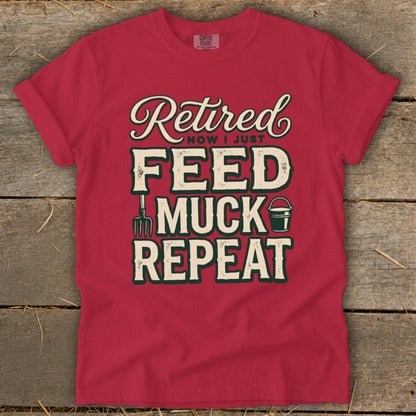 Red t-shirt with "Retired Now I Just Feed Muck Repeat" graphic and farm tools.