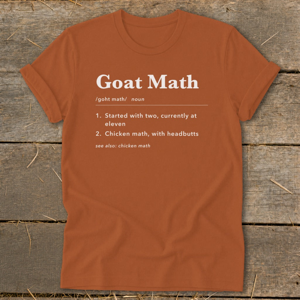 Orange t-shirt with "Goat Math" definition printed in white.