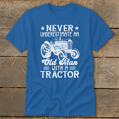 Blue t-shirt with white graphic: Never Underestimate an Old Man with a Tractor.