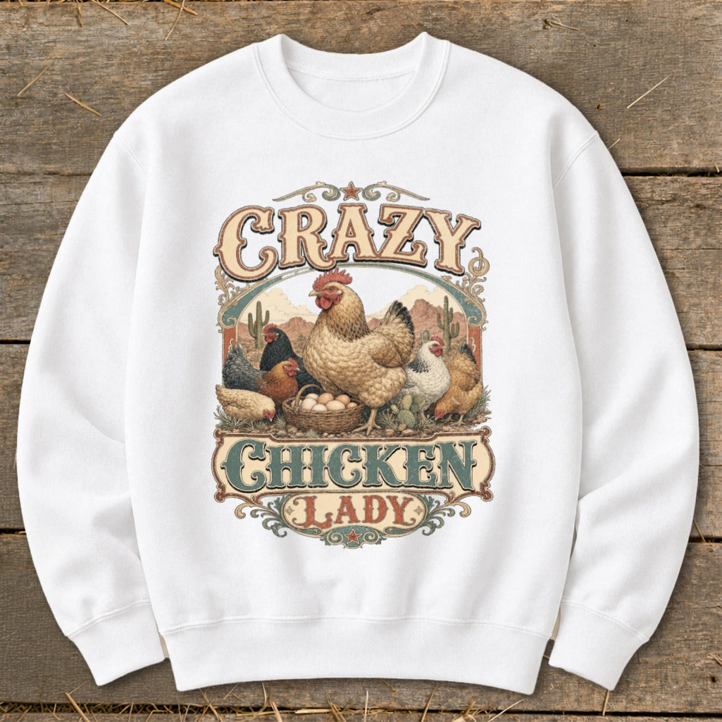 White sweatshirt with vintage "Crazy Chicken Lady" graphic featuring chickens and eggs.