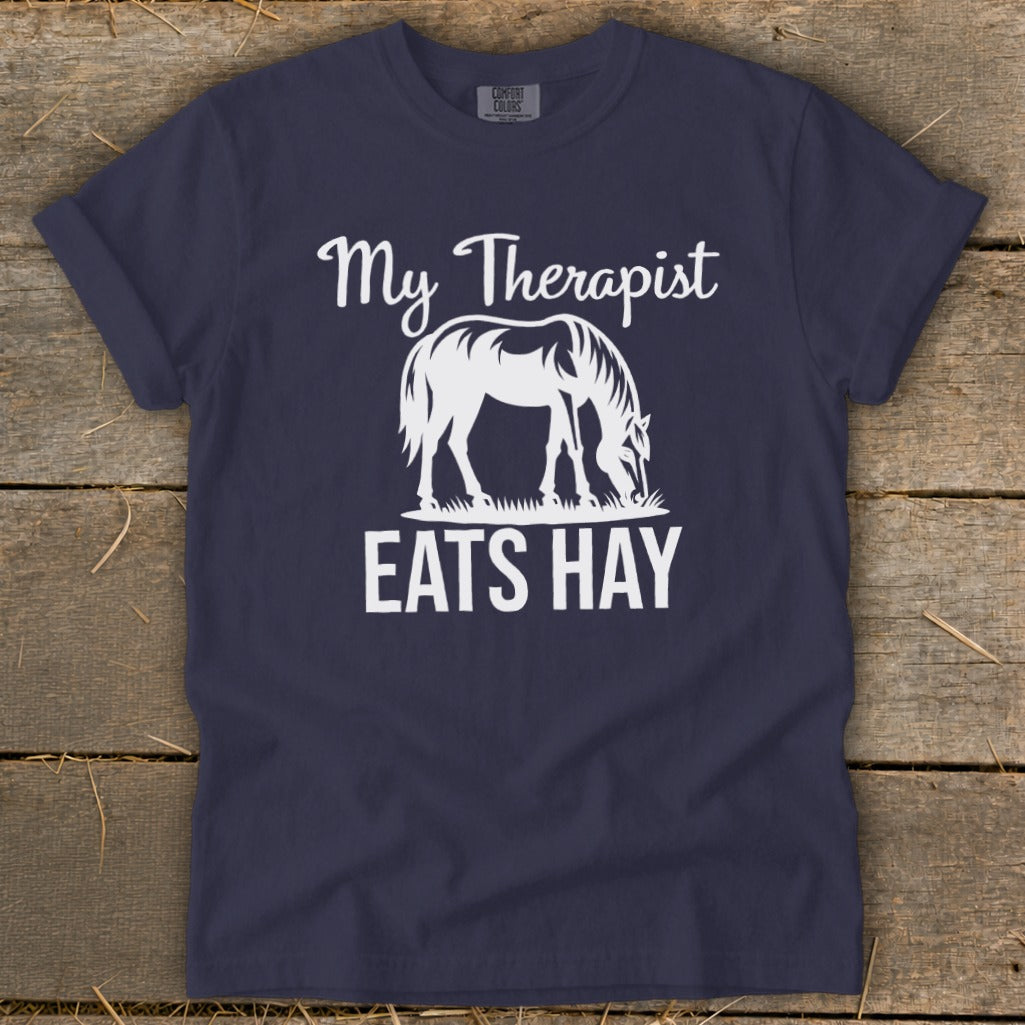Navy t-shirt with white text "My Therapist Eats Hay" and horse graphic.