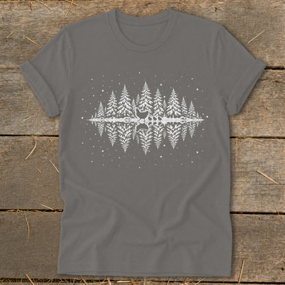 Gray t-shirt with white silhouette of pine trees reflected in water and falling snow.