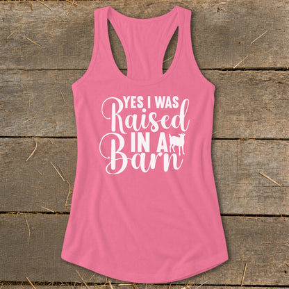 Pink tank top with white text "YES I WAS Raised IN A Barn" and a goat graphic.