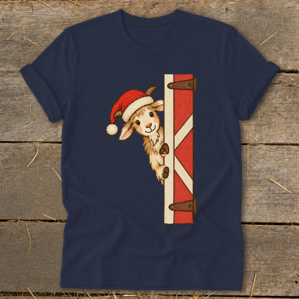 T-shirt with a cute goat wearing a Santa hat peeking around a barn door.