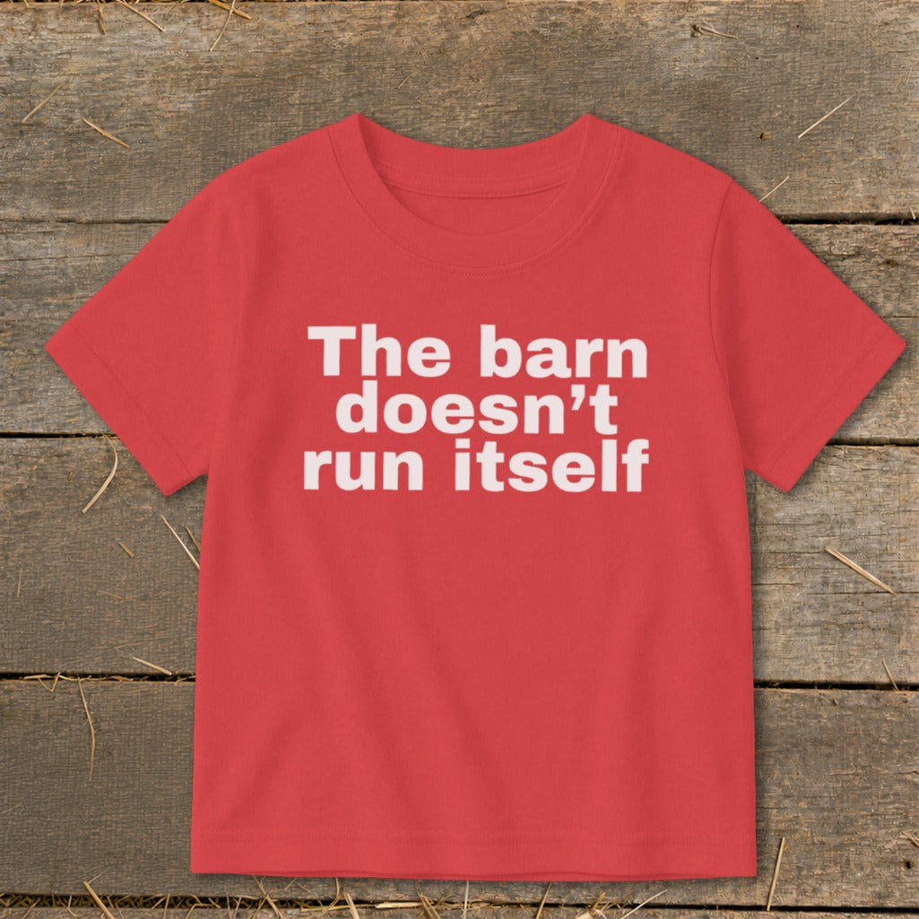 Red t-shirt with white text reading "The barn doesn't run itself".