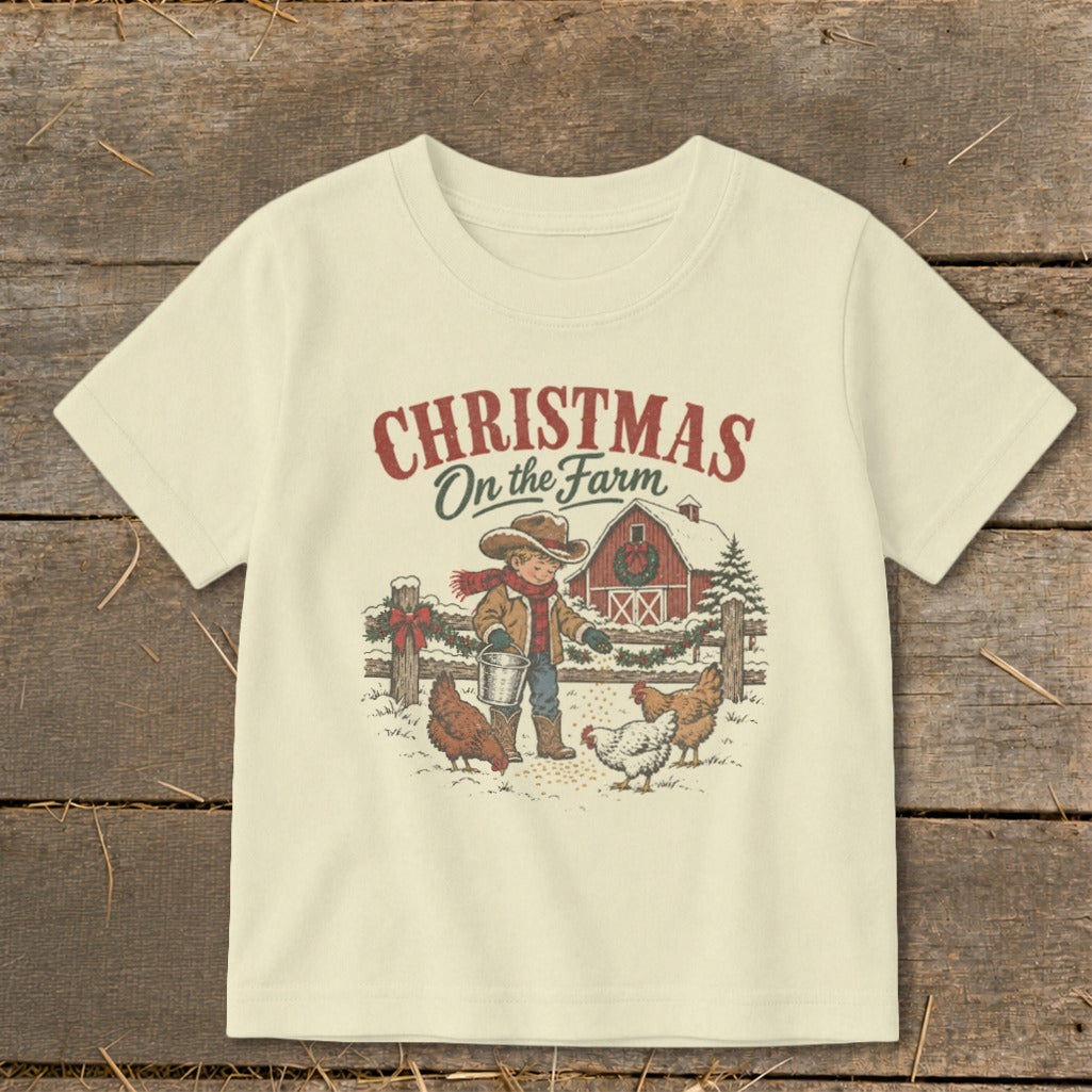 Christmas on the Farm graphic with boy feeding chickens by a barn.