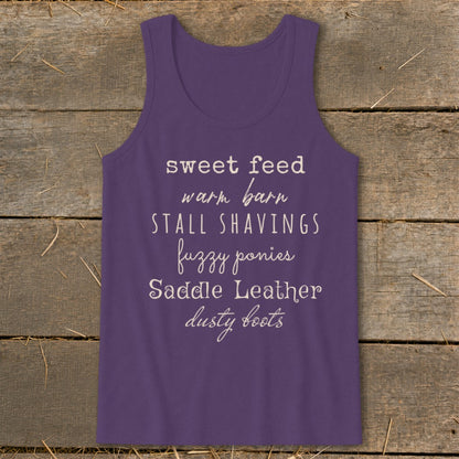 Purple tank top with text: sweet feed, warm barn, stall shavings, fuzzy ponies, saddle leather, dusty boots.