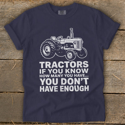 Navy t-shirt with a tractor graphic and the text "Tractors If You Know How Many You Have... You Don't Have Enough."